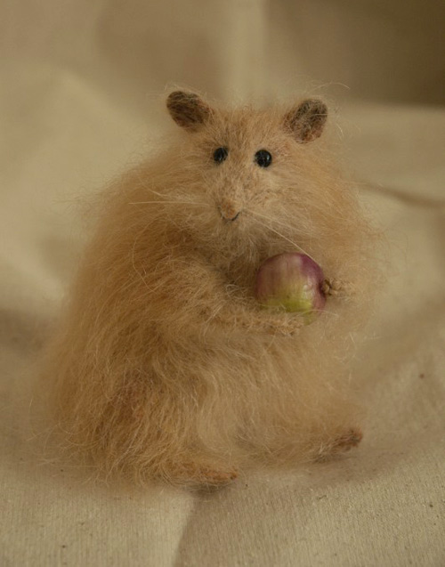hamster holding an apple