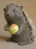 stuffed hedgehog with an apple