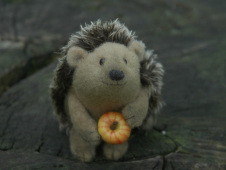 fat hedgehog with an apple