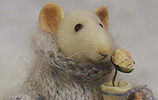 stuffed rat with a flowerpot