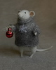 stuffed mouse with a christmas ball